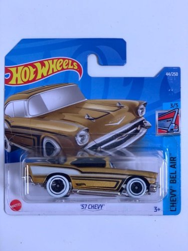 Hot Wheels - 57 Chevy Gold - varianta karty: POŠKOZENÝ OBAL