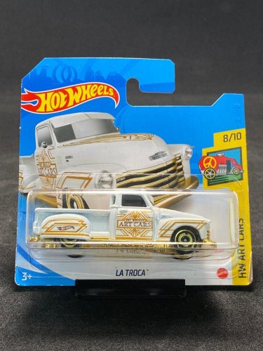 Hot Wheels -La Troca white/gold - varianta karty: ROZTRHNUTÝ OBAL